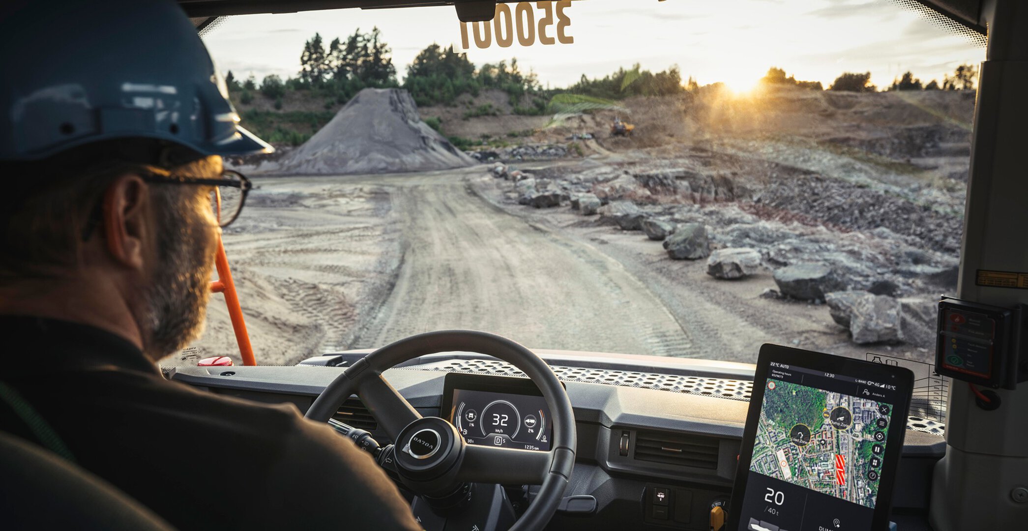 A professional operator's perspective from a Volvo cab, utilizing digital guidance systems to enhance site safety and productivity in Africa.