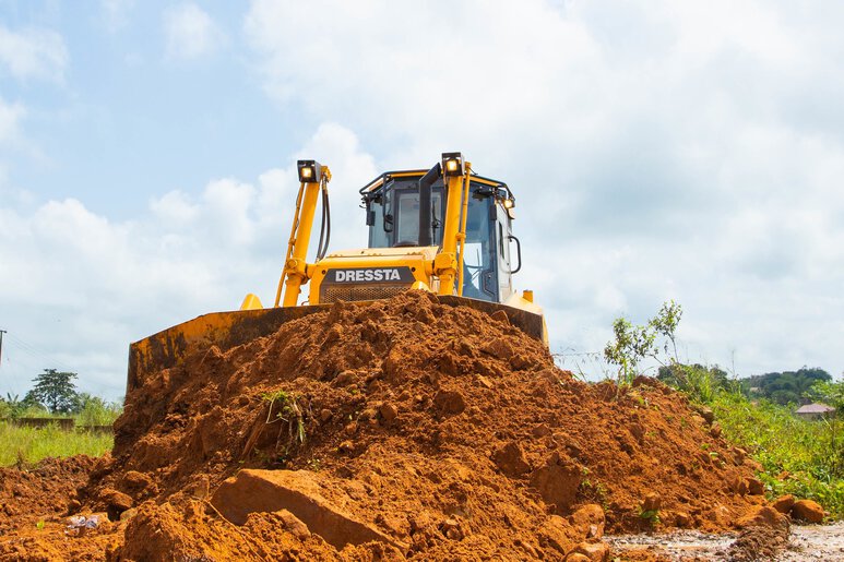 Specialized Dressta bulldozer designed for forestry applications, log management, and heavy-duty land clearing